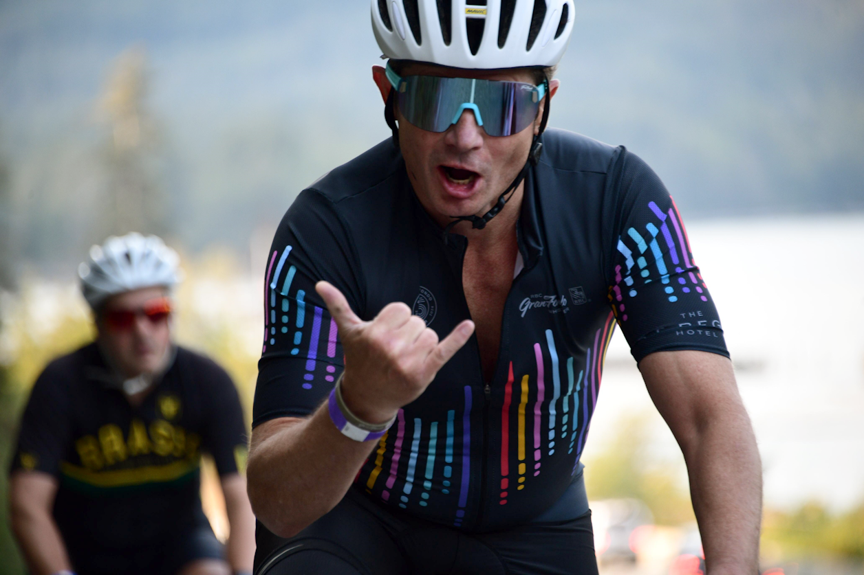 Photo: High 5’s and good vibes only at the 15th Annual RBC GranFondo Whistler. Check out the Kits Eyecare.