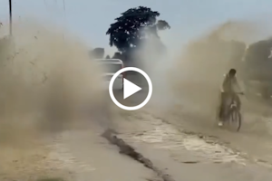 Instant Karma: Car Splashes Cyclist