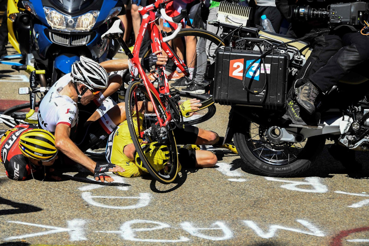 triggering a pile-up that sent Froome crashing into the tarmac and destroyed his bike beyond immediate use triggering a pile-up that sent Froome crashing into the tarmac and destroyed his bike beyond immediate use