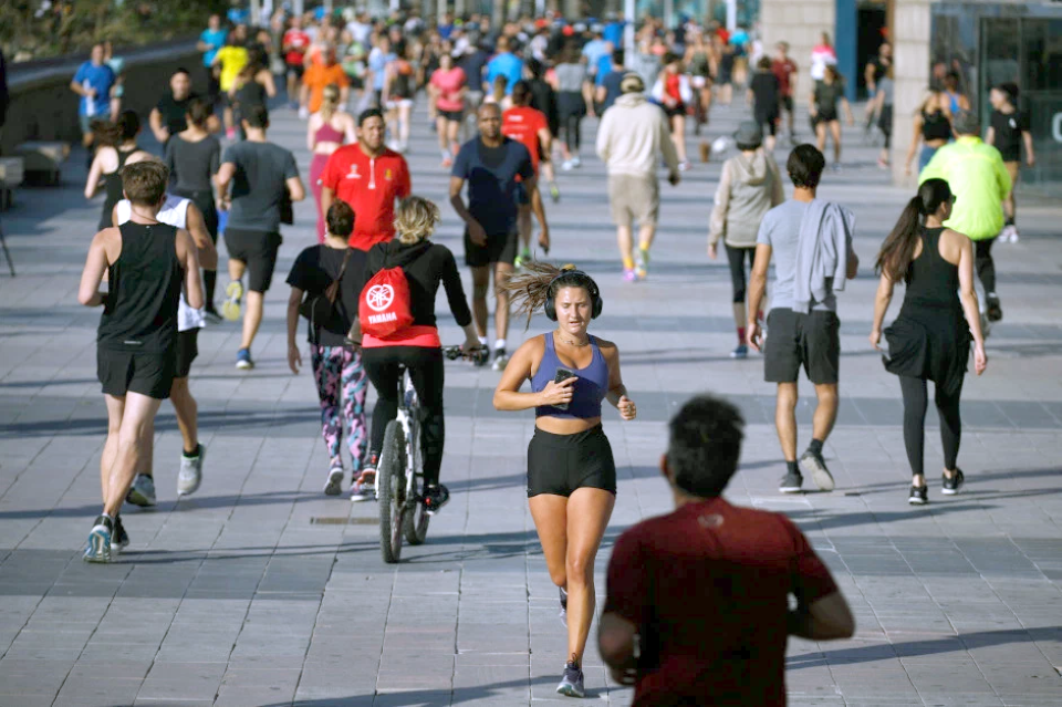 Spanish Surfers, Cyclists and Joggers rush outside to exercise after 49 days of lock-down
