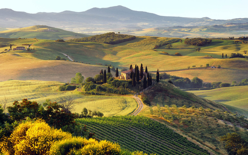 watching the sun slowly rise across the Tuscan landscape