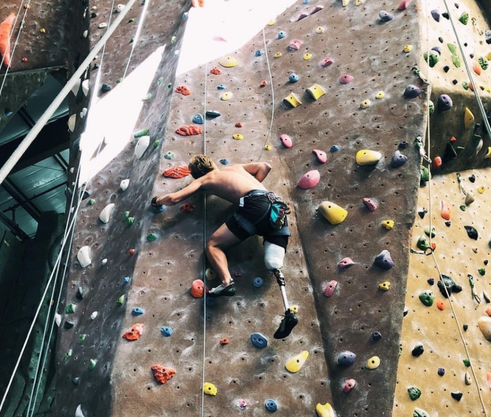 With his new prosthetic leg, he's been out riding and has also been learning to use his new leg with his other passion climbing - on a vertical climbing wall.