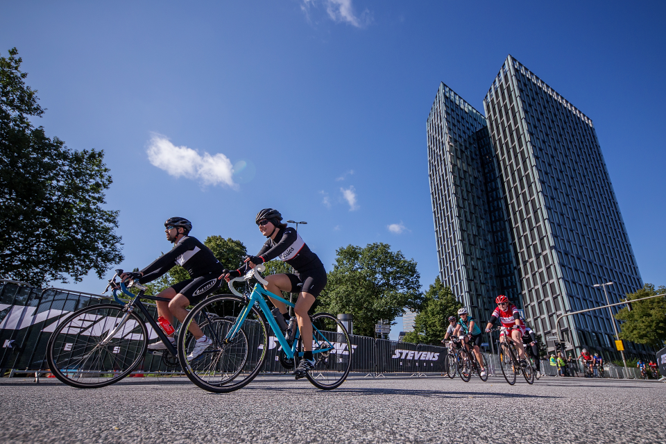 Photo: DANCING. Age Group athletes in front of the "tanzende Türme" (dancing towers). © Getty Images for VELOTHON