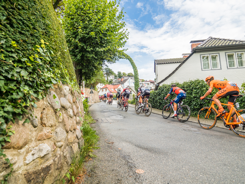 Photo: CLIMBING 2. Pro athletes riding the scenic Treppenviertel. © David Rothenhaeuser for IRONMAN