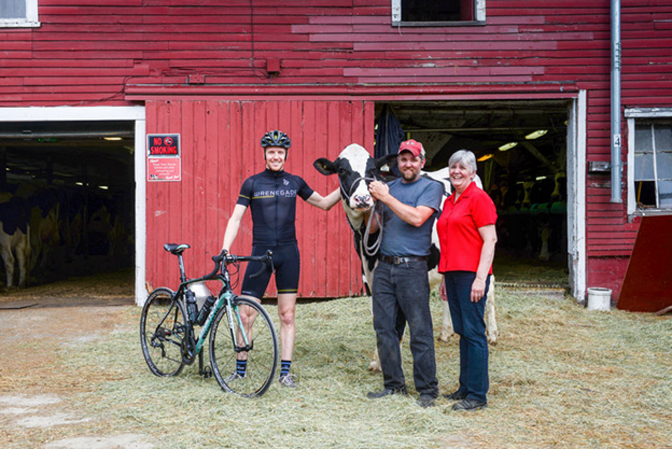 Farm to Fork Fondo series founder Tyler Wren with the Kennet Family of featured farm Liberty Hill Farm in Rochester, Vermont