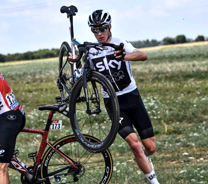 Chris Froome battled back to limit his losses after a crash and a chaotic finish to stage one at the Tour de France