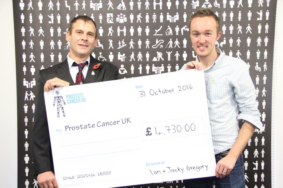 Ian Gregory presents 3 Ton Challenge fundraising cheque to Jon Medcraft, Sporting Events Manager at Prostate UK