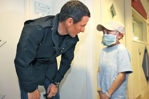 Armstrong with a young cancer patient.