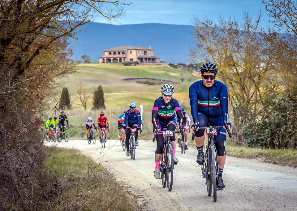 Garda Bike Hotel's Nicola Verdolin leads Calla Barras and other clients onto the famous white roads of Tuscany